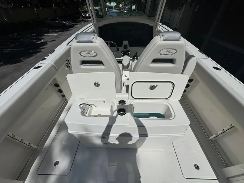 Slide: The Image of 2026 Sailfish 312 CC boat interior with seating and storage compartments. - 24