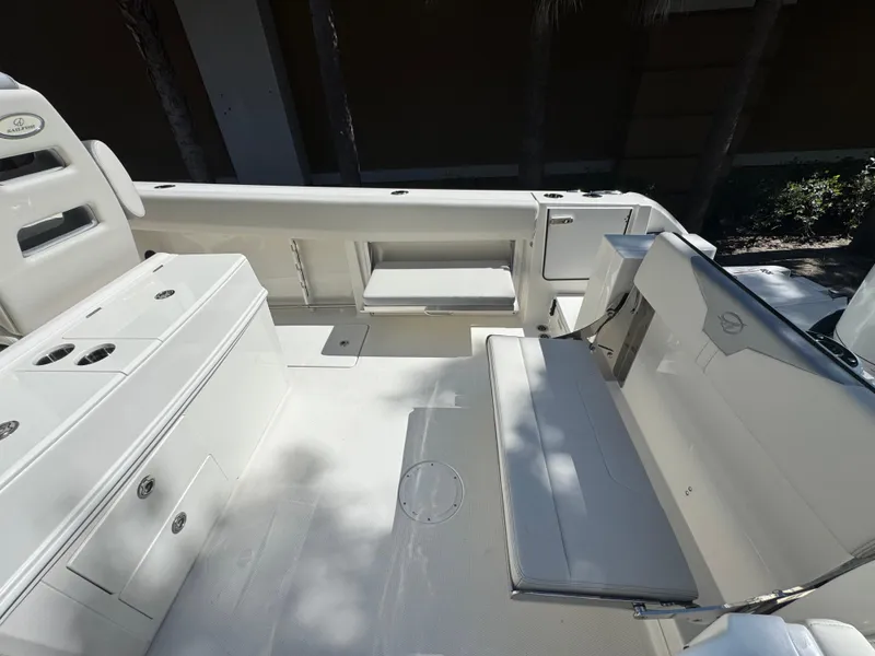 Slide: The Image of 2026 Sailfish 312 CC boat interior with seating and storage compartments. - 27
