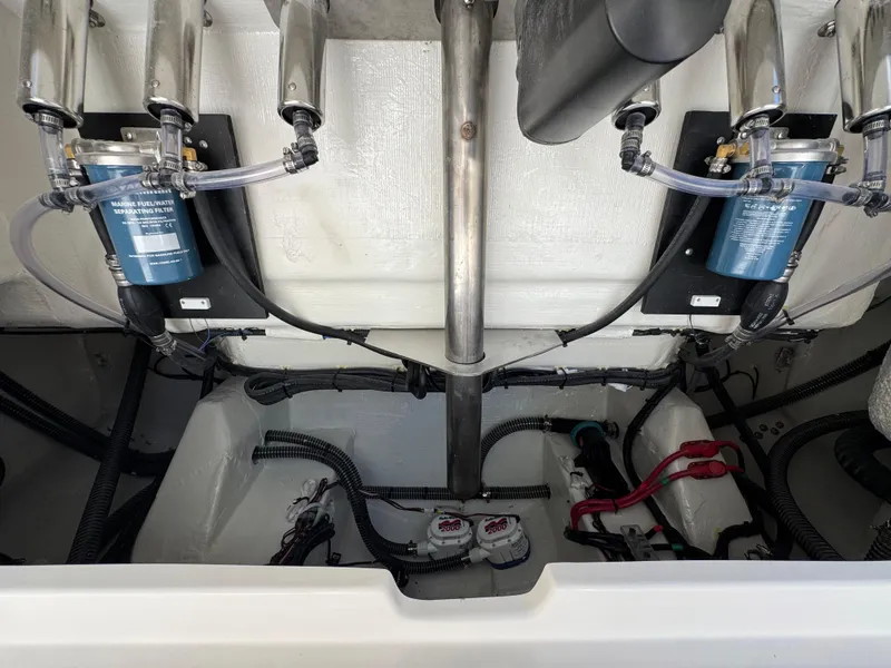 Slide: The Image of Engine compartment of 2026 Sailfish 312 CC boat with fuel filters and wiring. - 35