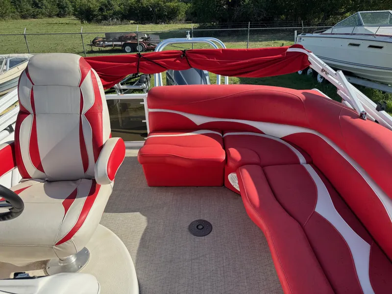 Slide: The Image of Red and white seating on 2020 Aloha Tropical Series 230 boat deck. - 4
