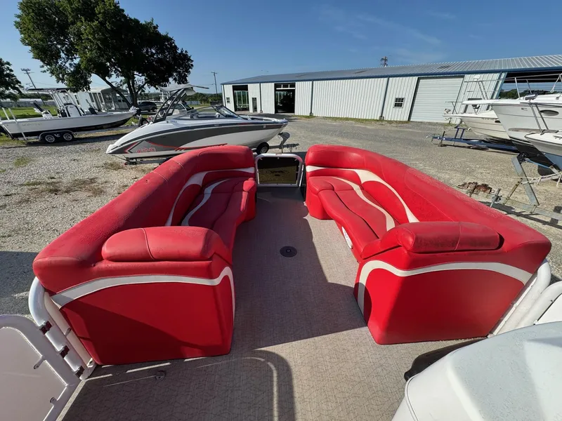 Slide: The Image of Red seating on 2020 Aloha Tropical Series 230 pontoon boat, parked outdoors. - 5
