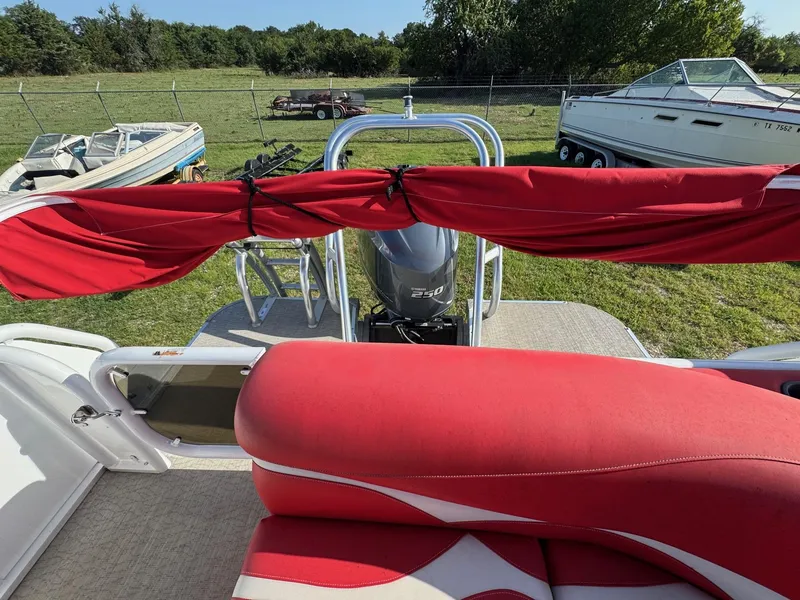 Slide: The Image of Red and white interior of 2020 Aloha Tropical Series 230 boat with Yamaha 250 engine. - 7