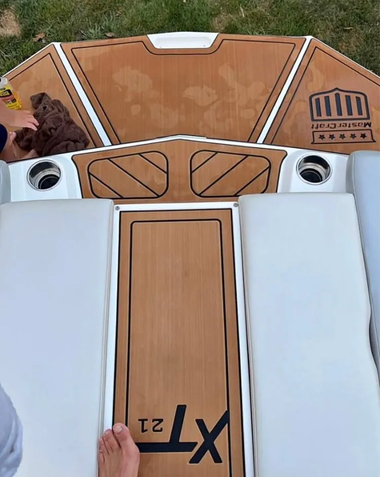 Slide: The Image of 2018 MasterCraft XT21 boat deck with teak flooring and white seating. - 6