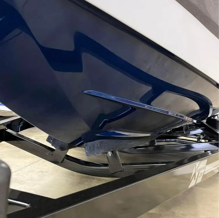 Slide: The Image of 2018 MasterCraft XT21 boat hull on trailer, showcasing sleek design and craftsmanship. - 9
