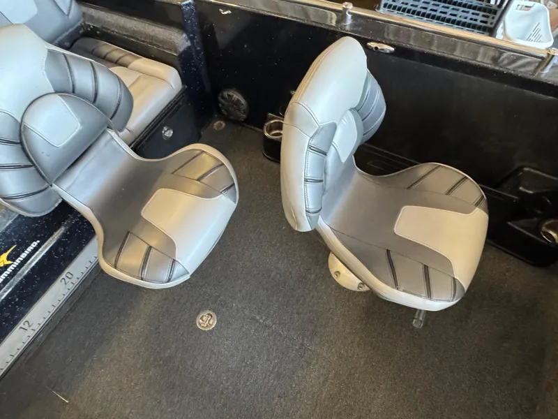 Slide: The Image of Gray and black seat in a 2020 Nitro ZV19 Sport boat interior. - 10