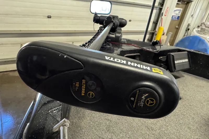 Slide: The Image of Minn Kota Ulterra motor on 2020 Nitro ZV19 Sport boat in a garage setting. - 17