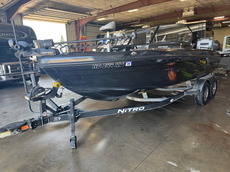 Slide: The Image of 2020 Nitro ZV19 Sport boat on trailer in indoor storage facility. - 2