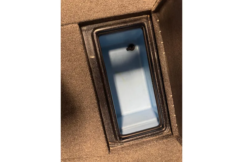 Slide: The Image of Storage compartment of a 2020 Nitro ZV19 Sport boat, featuring a blue interior. - 25
