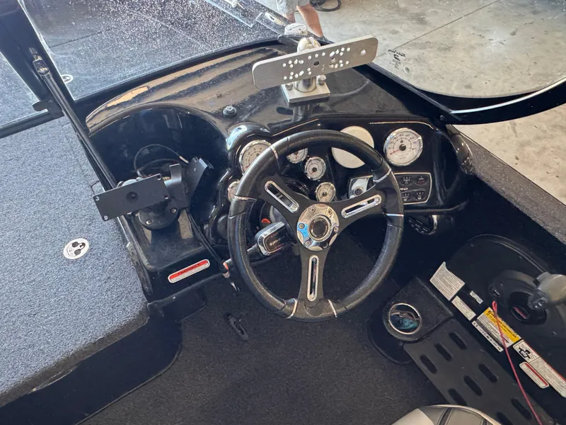 Slide: The Image of 2020 Nitro ZV19 Sport boat interior with steering wheel and seat. - 6