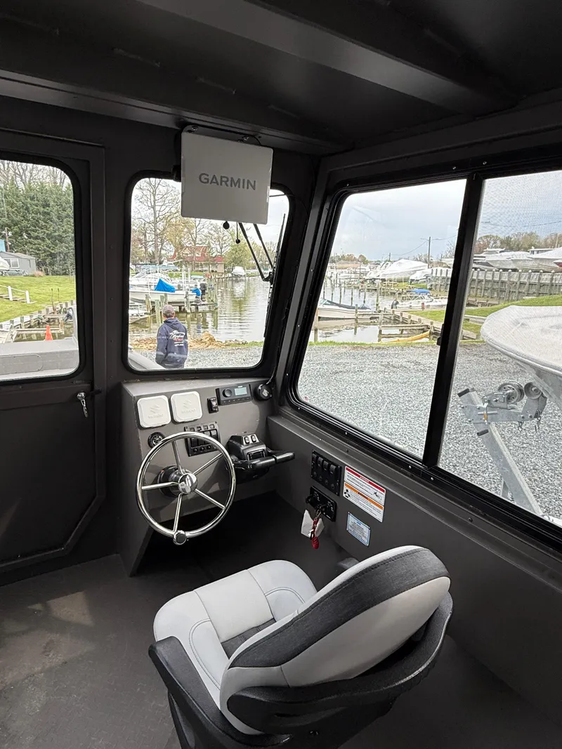 Slide: The Image of Interior of 2025 SeaArk 2672 Workhorse boat with Garmin navigation system. - 4