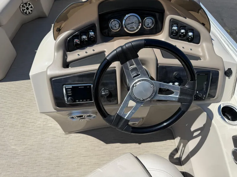 Slide: The Image of 2017 Bennington G22 boat dashboard with steering wheel and control panel. - 10