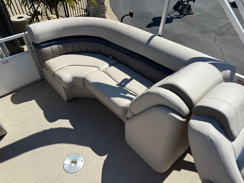 Slide: The Image of 2017 Bennington G22 boat interior with beige seating and sleek design. - 15