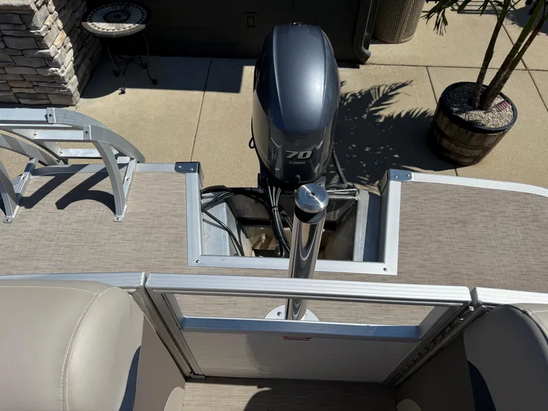 Slide: The Image of 2017 Bennington G22 pontoon boat with Yamaha 70 outboard motor, docked on concrete. - 16