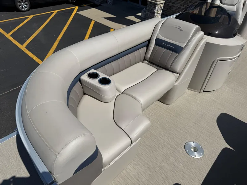 Slide: The Image of 2017 Bennington G22 boat interior with plush seating and cup holders. - 4