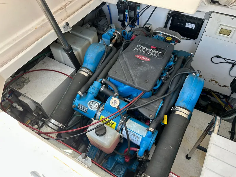 Slide: The Image of Engine compartment of a 2004 Tiara Yachts 3200 Open, featuring a Crusader engine. - 23
