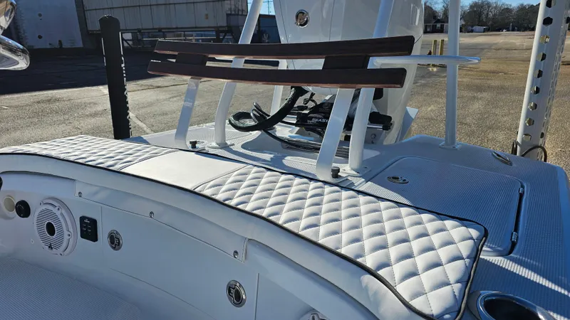 Slide: The Image of 2025 Chaos 16 Bonefish boat interior with quilted seating and modern controls. - 9