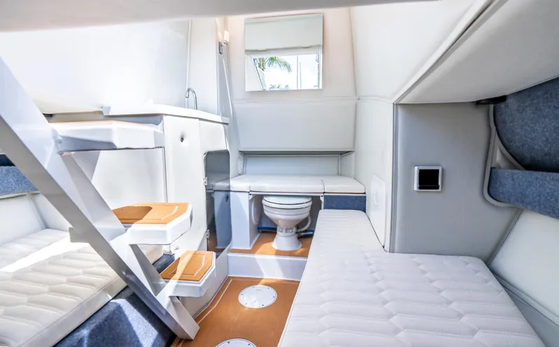 Slide: The Image of Interior of 2026 Novielli Veloche 349 boat, featuring compact bathroom and seating area. - 6