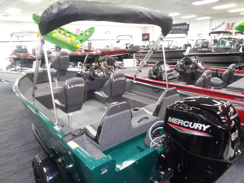 Slide: The Image of 2025 Lund 1650 Rebel XL SS boat with Mercury 60 engine in showroom. - 15