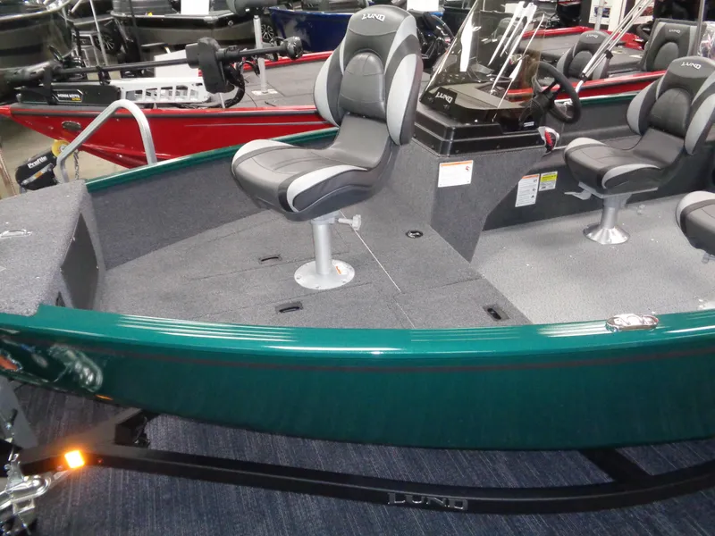 Slide: The Image of 2025 Lund 1650 Rebel XL SS boat interior with seating and steering console. - 3