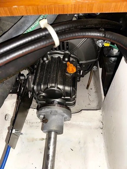 Slide: The Image of Engine compartment of a 2017 Catalina 315 sailboat, showcasing mechanical components and wiring. - 10