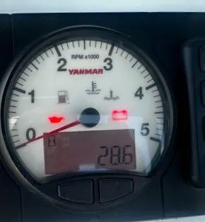 Slide: The Image of Yanmar RPM gauge on a 2017 Catalina 315 sailboat, displaying 2.86 RPM x 1000. - 11