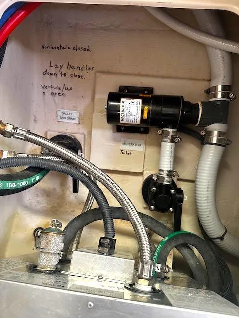 Slide: The Image of Boat plumbing system with macerator pump in a 2017 Catalina 315 model. - 16
