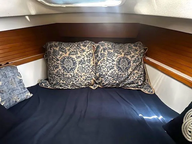 Slide: The Image of Cozy cabin interior of 2017 Catalina 315 sailboat with decorative pillows. - 8