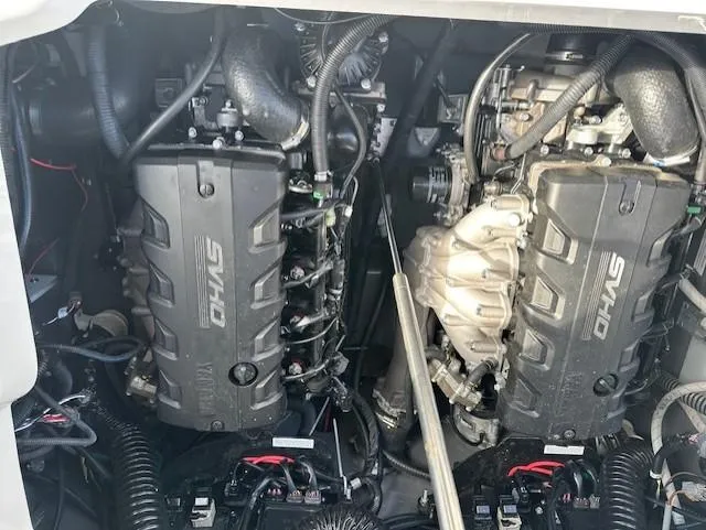 Slide: The Image of 2022 Yamaha Boats 255 FSH Sport E engine compartment with dual SVHO engines. - 8