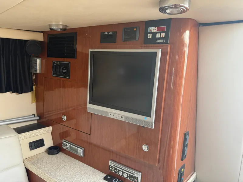 Slide: The Image of Interior of 2005 Regal 3350 Sport Cruiser with TV and control panel. - 10