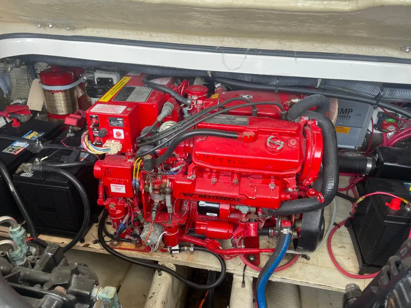 Slide: The Image of Engine compartment of a 2005 Regal 3350 Sport Cruiser with red machinery and wiring. - 7