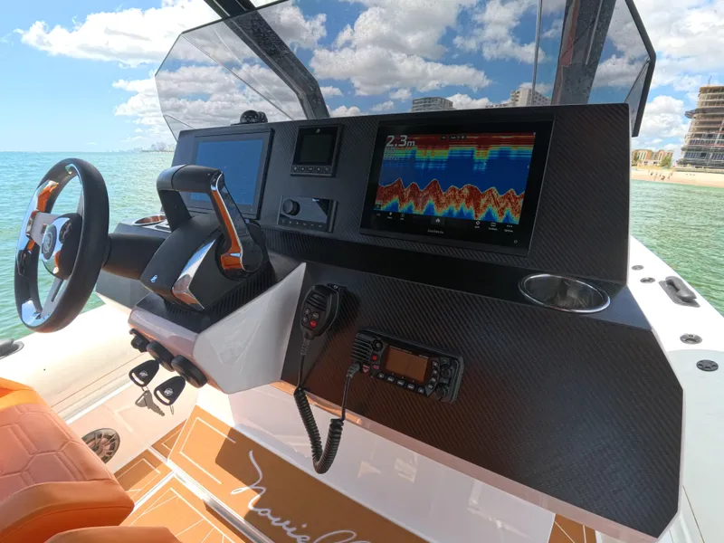 Slide: The Image of Helm of Novielli Veloche 349 boat, featuring advanced navigation technology, 2026 model. - 14