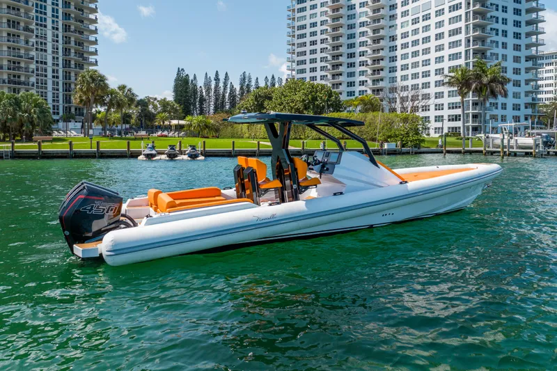 Slide: The Image of Novielli Veloche 349 boat on water, 2026 model, near waterfront buildings and greenery. - 18