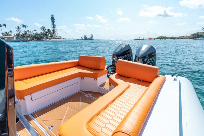 Slide: The Image of 2026 Novielli Veloche 349 boat with orange seating, dual engines, and ocean view. - 19