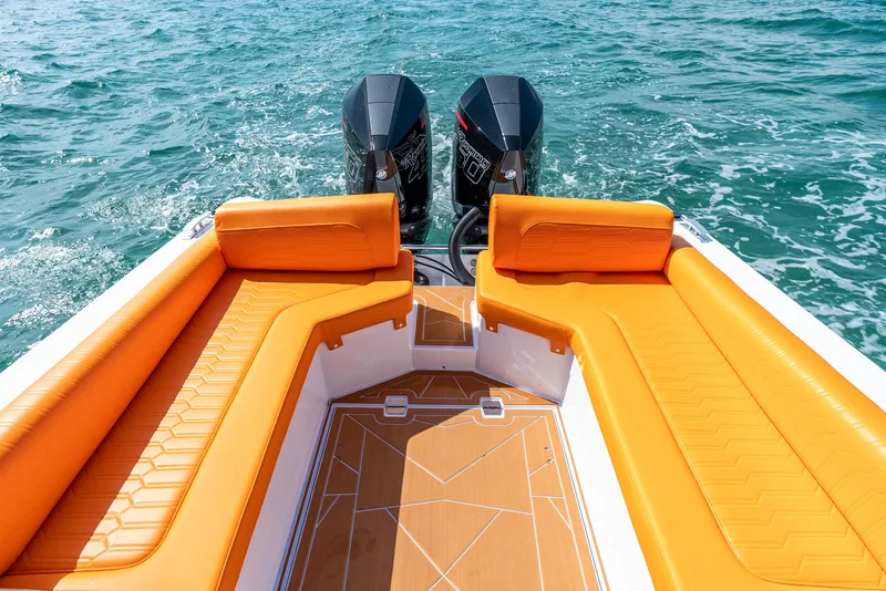 Slide: The Image of Luxury Novielli Veloche 349 boat with orange seating, dual engines, cruising on blue water. - 20
