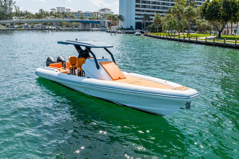 Slide: The Image of 2026 Novielli Veloche 349 boat on clear water, modern design, vibrant orange seating. - 8