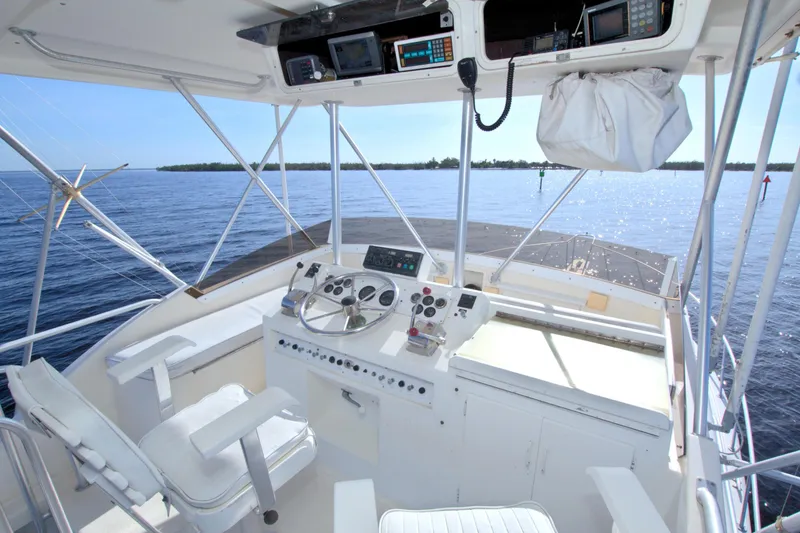Slide: The Image of Cockpit of 1990 Post 44 Sport Fisherman boat with ocean view and navigation equipment. - 13