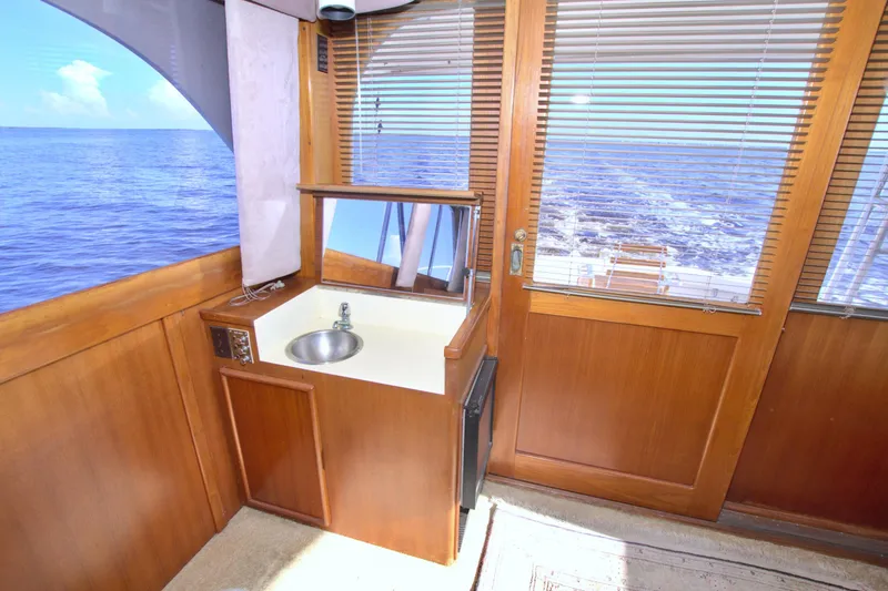 Slide: The Image of Interior of 1990 Post 44 Sport Fisherman yacht with sink and ocean view. - 36
