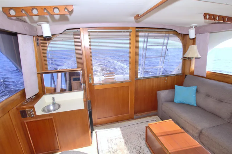 Slide: The Image of Interior of 1990 Post 44 Sport Fisherman yacht with sofa, sink, and ocean view. - 37