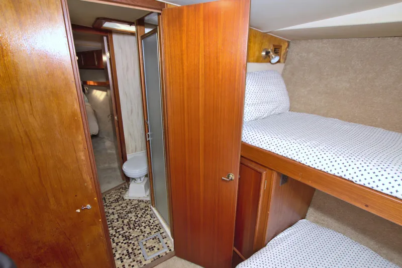 Slide: The Image of Interior of 1990 Post 44 Sport Fisherman with bunk beds and bathroom. - 57