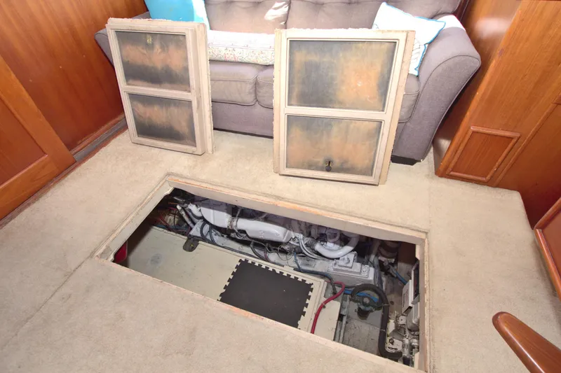 Slide: The Image of Engine compartment access in 1990 Post 44 Sport Fisherman boat interior. - 63