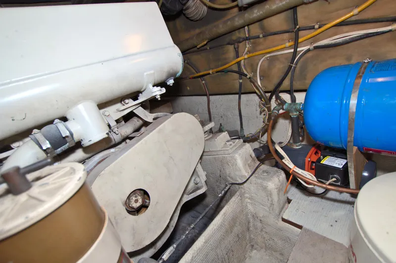 Slide: The Image of Engine room of 1990 Post 44 Sport Fisherman with visible machinery and wiring. - 67