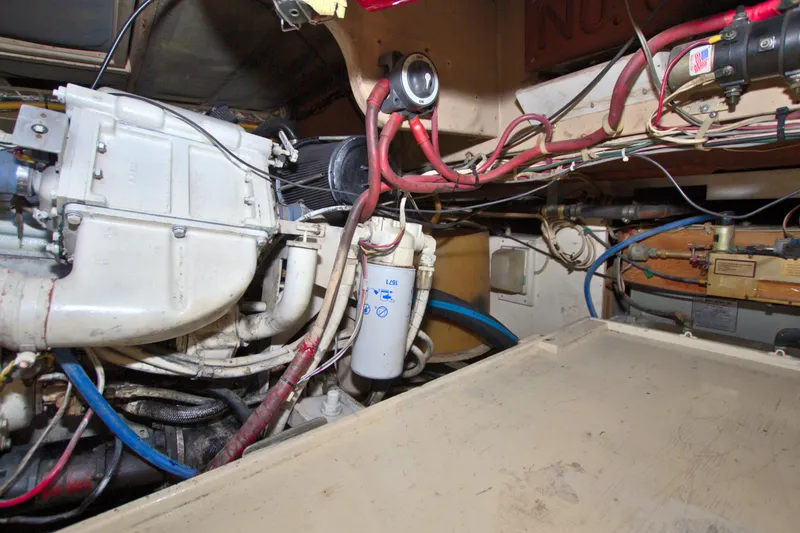Slide: The Image of Engine room of 1990 Post 44 Sport Fisherman with visible wiring and components. - 74