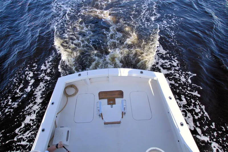 Slide: The Image of Aerial view of 1990 Post 44 Sport Fisherman boat cruising on water. - 19