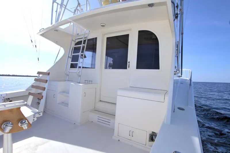 Slide: The Image of 1990 Post 44 Sport Fisherman boat deck with seating and ocean view. - 24