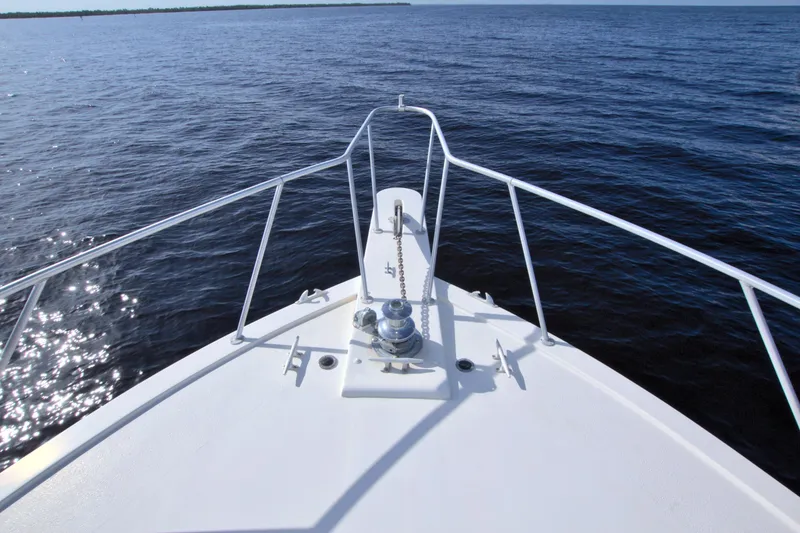 Slide: The Image of Bow of 1990 Post 44 Sport Fisherman boat on open water. - 27