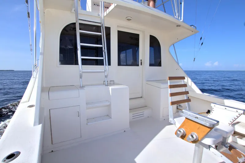 Slide: The Image of 1990 Post 44 Sport Fisherman boat deck with seating and ocean view. - 32