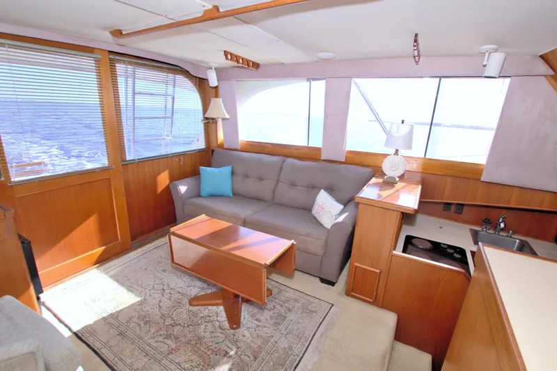 Slide: The Image of Interior of 1990 Post 44 Sport Fisherman yacht with sofa, table, and ocean view. - 33