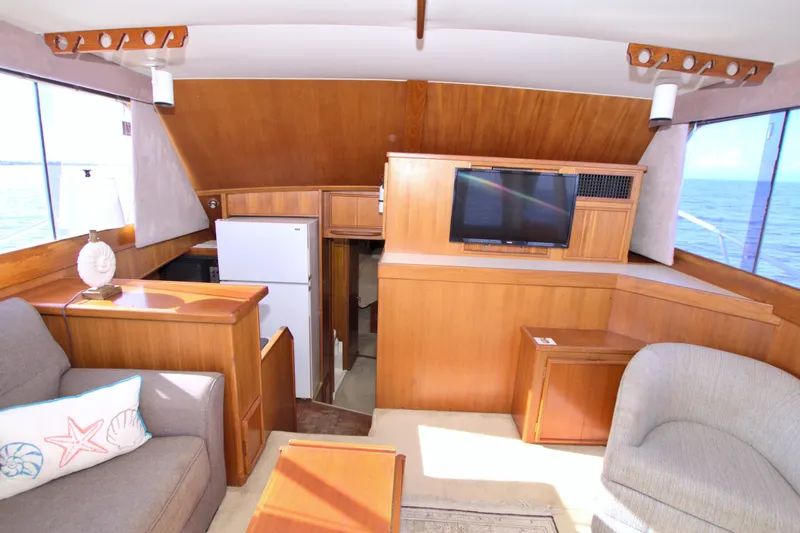 Slide: The Image of Interior of 1990 Post 44 Sport Fisherman yacht with cozy seating and ocean view. - 34