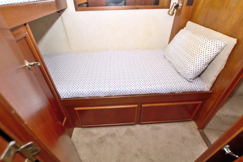 Slide: The Image of Cozy cabin bed in 1990 Post 44 Sport Fisherman yacht with polka dot bedding. - 60