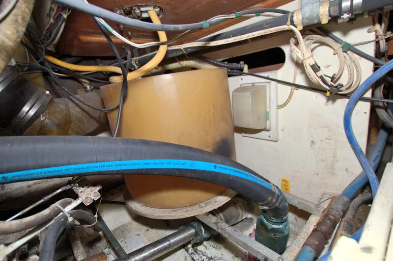 Slide: The Image of Engine room of 1990 Post 44 Sport Fisherman with hoses and wiring. - 75